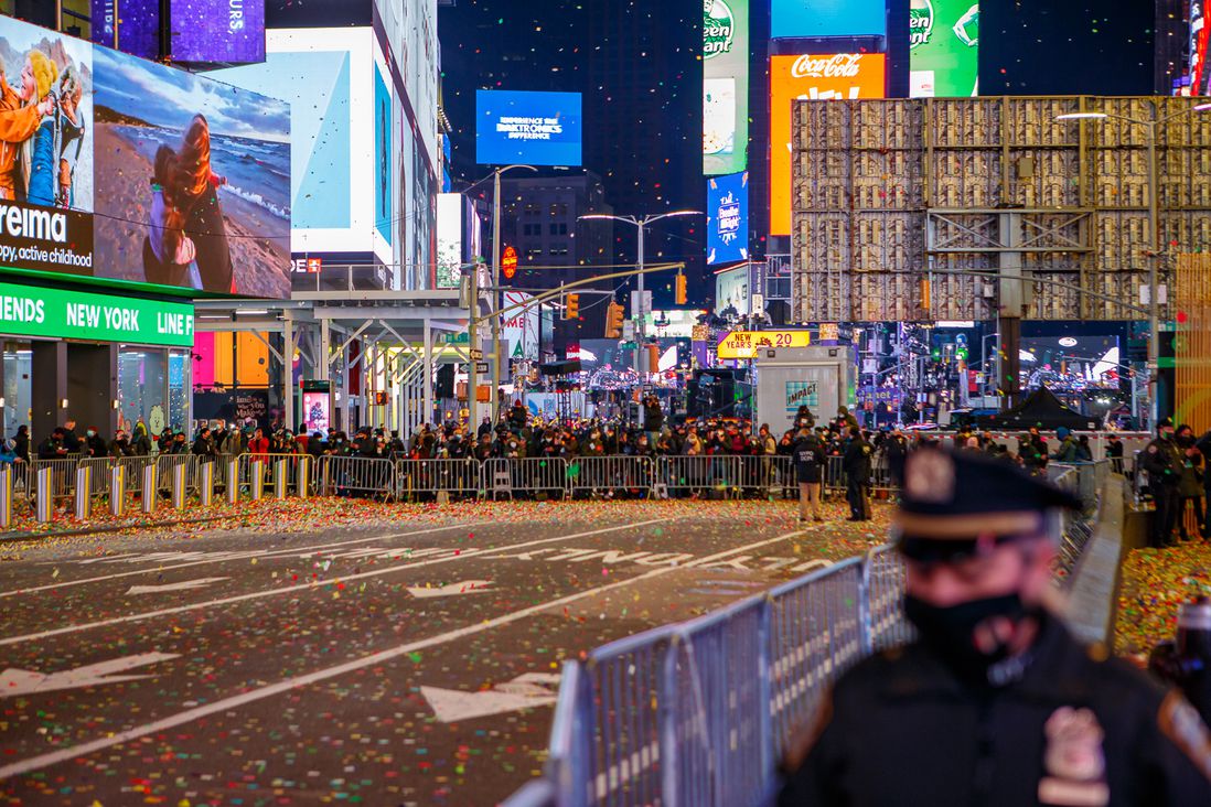 A relatively empty Times Square with confetti in the air
